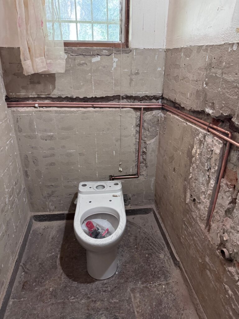 New toilet fitted with fresh copper water pipes