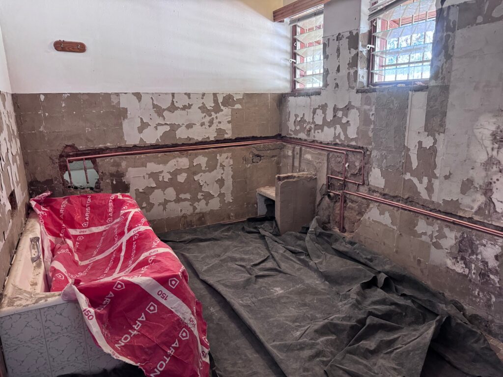 Stripped bathroom with new copper plumbing